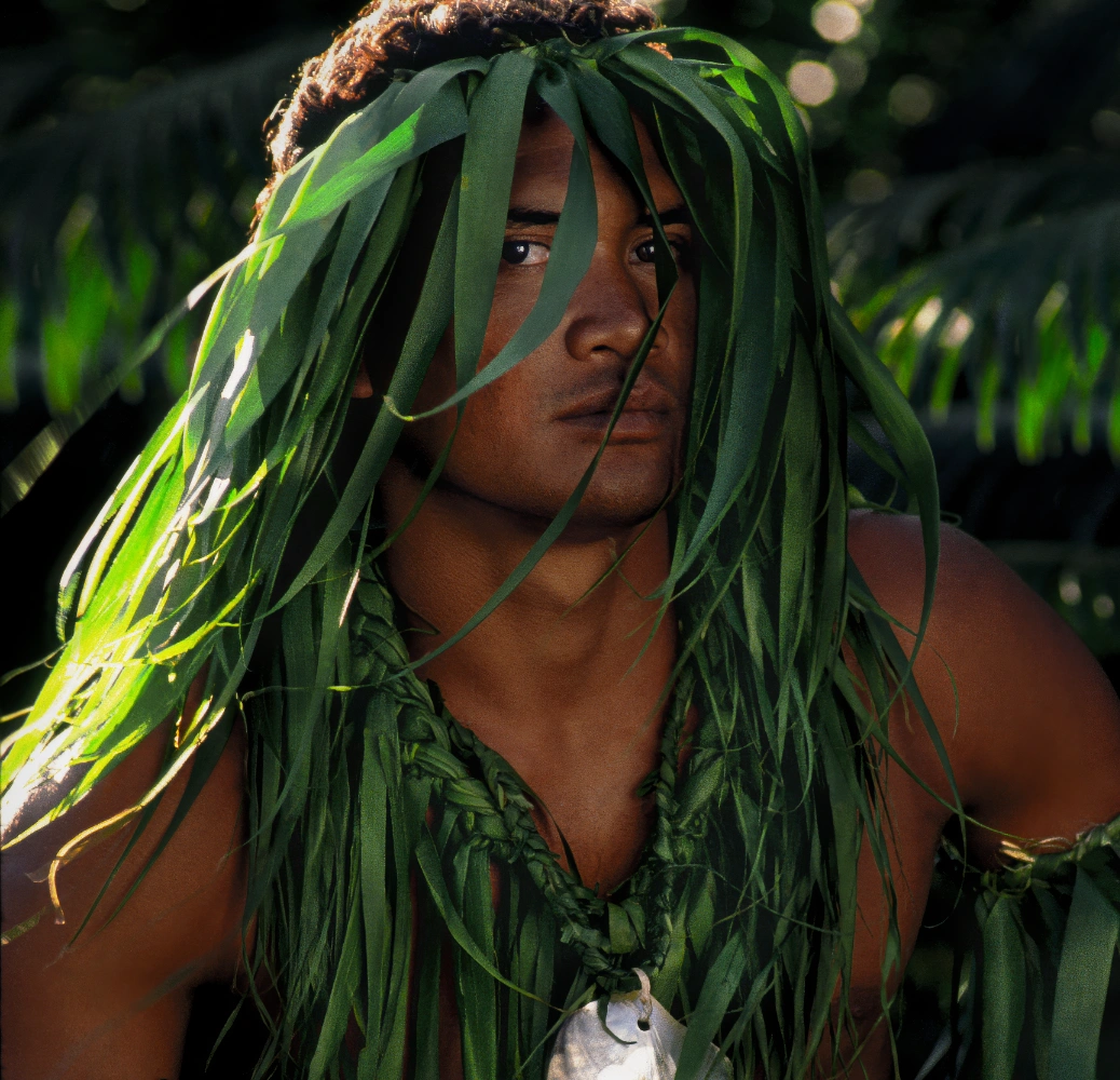 Tahitian man in a green crown.