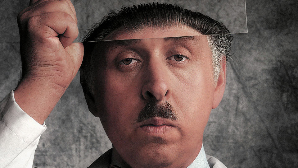 A photolab technician with half a brain.